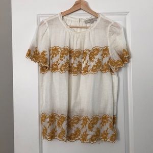 Embroidered yellow and white blouse